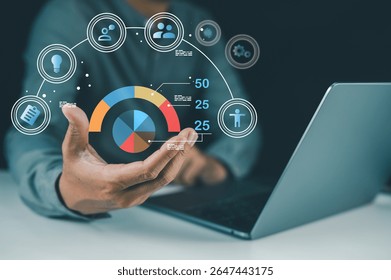 A person interacts with a virtual data visualization, showing charts and icons above a laptop, representing digital analytics and business intelligence.