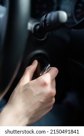 Person Jams The Car And Takes The Key Out Of The Ignition. Safety In The Car. Hand With Key Close-up