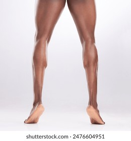 Person, legs and muscles in studio with calves for workout progress, exercise goals and fitness. Bodybuilder, muscular athlete and flexing thighs for healthy body and gym target on white background - Powered by Shutterstock