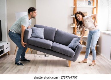 Person Lifting Heavy Furniture Couch Having Back Injury