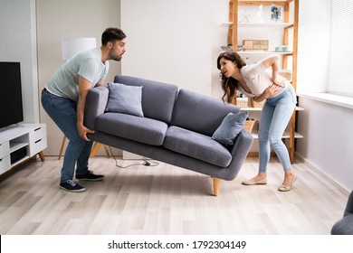 Person Lifting Heavy Furniture Couch Having Back Injury