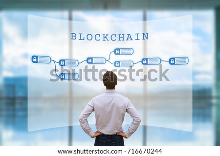 Person looking at blockchain concept on screen as a secured decentralized ledger for cryptocurrency financial technology and business transaction data, fintech