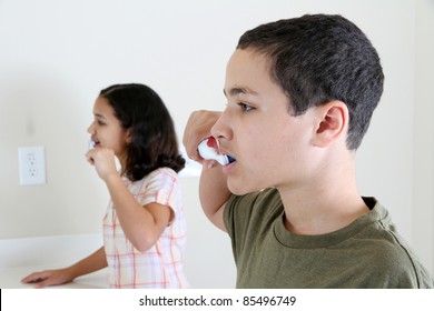 Person Looking Into A Mirror Brushing Their Teeth