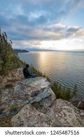 Person Looking Out Over Lake Vättern, Sweden From Omberg Mountain