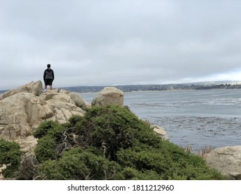 Person Looking Over The Ocean 