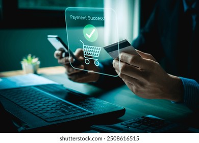 Person Making Online Payment with Credit Card on Laptop, Holographic Interface Showing Payment Successful and Shopping Icons, Representing E-commerce and Digital Transactions - Powered by Shutterstock