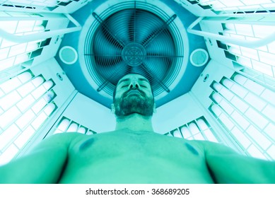 Person making uv ray treatment in the solarium