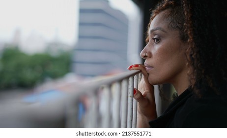 Person Observing The Street Outside From Home Balcony A Black Woman Spying Looking Out