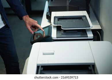 Person In Office Using Printer And Pressing On Its Screen