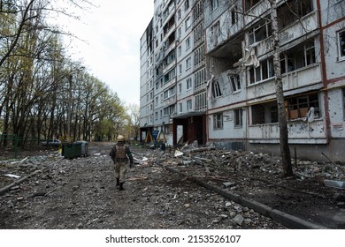 Person on The Background of destroyed Ukrainian Buildings After russian Missile Hit 