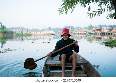 Person on a boat, Beautiful nature of Dal Lake, Kashmir, India.