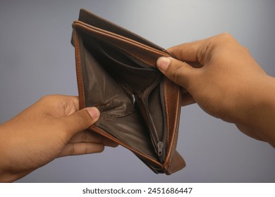 person opens empty wallet no money, 19 april 2024, yogyakarta indonesia. - Powered by Shutterstock