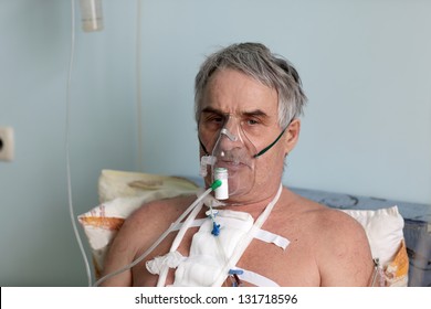 Person With Oxygen Mask In A Hospital Ward