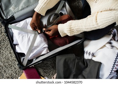 A person packing for a trip