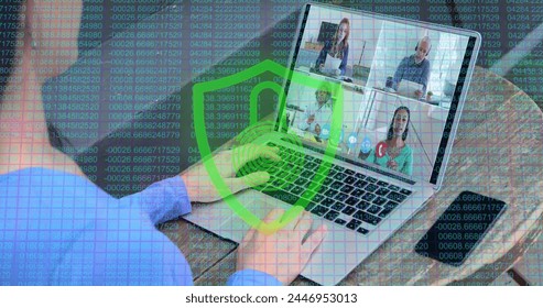 Person participates in a virtual meeting on a laptop. Digital overlays suggest a focus on cybersecurity or data analysis in a remote work setting. - Powered by Shutterstock