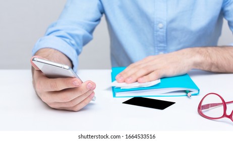 Person Paying Bills Via A Smartphone, Man's Hands, Cropped Image, Closeup