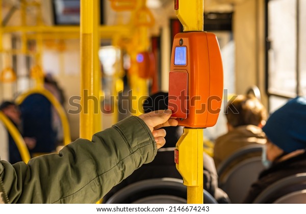 a person pays for public\
transport with a plastic card by attaching the card to an\
electronic reader. contactless fare payment technology in public\
transport.