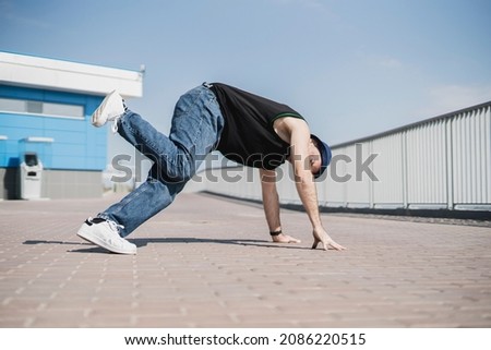 Similar – Athletic man warming up before running.