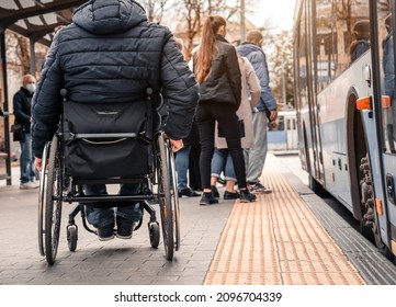 Person with a physical disability waiting for city transport with an accessible ramp. - Powered by Shutterstock