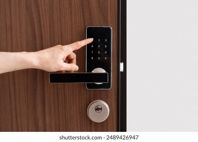 Person presses a button, enter pass code on digital lock with keypad. Digital technology, keyless system in hotel, privacy and security concepts - Powered by Shutterstock