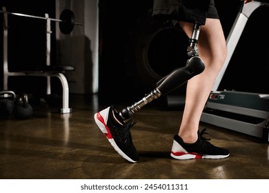 A person with a prosthetic leg walks on a treadmill in a gym, showing determination and strength in their workout routine. - Powered by Shutterstock