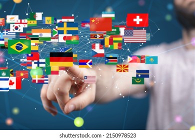 A Person Reaching Out To Different Country Flag Icons With Technological Network Particles Around Them