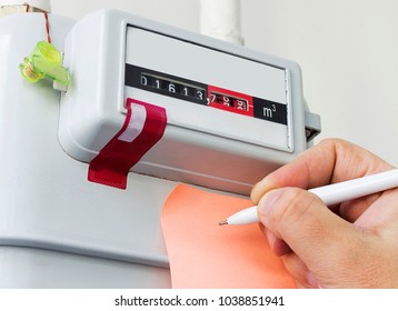 Person Reading The Gas Meter In The Private House, Counter For Distribution Domestic Gas. 