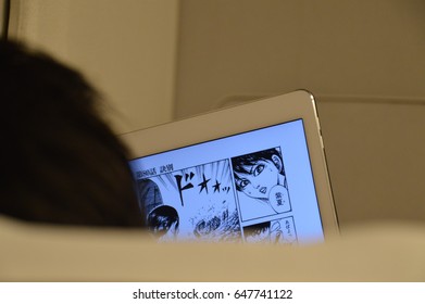 Person Reading Manga At A Tablet In The Train From Hiroshima To Onomichi 2016