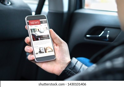 Person Reading Online News With Mobile Phone. Newspaper Website Mockup On Smartphone Screen. Man Enjoying Daily Press Service With Cellphone In Car. Latest Web Media Publication In The Morning.