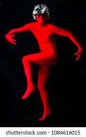 Person In Red Spandex Body Suit And Wig