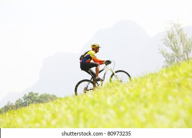 Person riding a bike up hill style