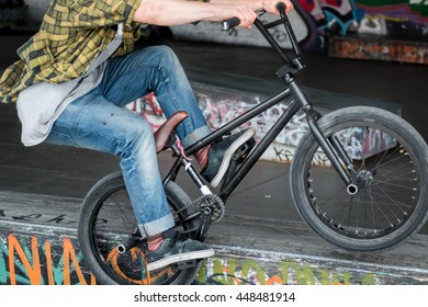 Person Riding BMX Flatland Freestyle At Skate Park