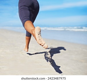 Person, running and feet at beach with exercise, sport and training for marathon by the sea. Workout, fitness and back of a athlete with health and wellness outdoor of runner with cardio in summer - Powered by Shutterstock