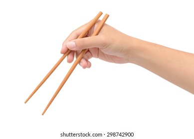 Person 's right hand using bamboo chopsticks against white background - Shutterstock ID 298742900