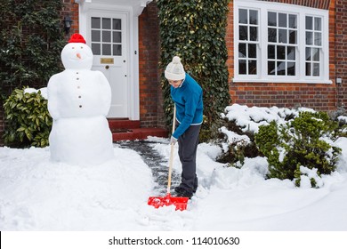 Person Shoveling Snow