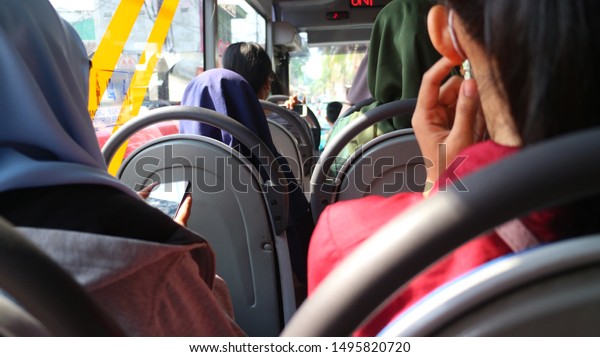 The\
person sitting on the bus seat - Selective\
focus