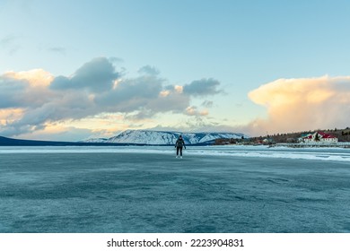 Person Skating On A Natural Frozen Lake In Northern Canada During Winter. 