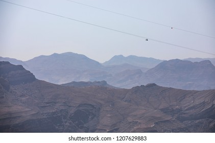 Person Sliding Down Jebel Jais Mountain Via World's Longest Zip Line.