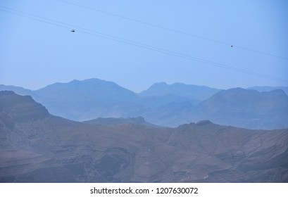 Person Sliding Down Jebel Jais Mountain Via World's Longest Zip Line.