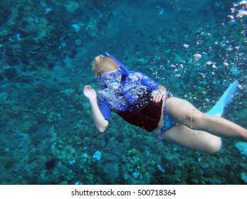 Person Snorkeling In Molokini Crater, Maui, Hawaii.