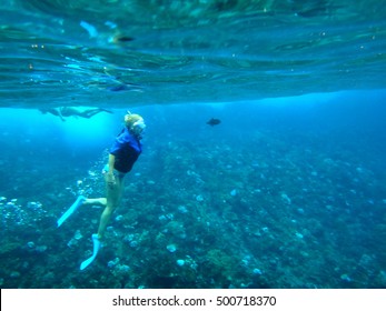 Person Snorkeling In Molokini Crater, Maui, Hawaii.