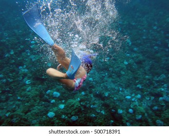 Person Snorkeling In Molokini Crater, Maui, Hawaii.