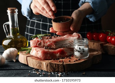 Person Sprinkles Spices On Raw Meat. Cooking Steak Concept