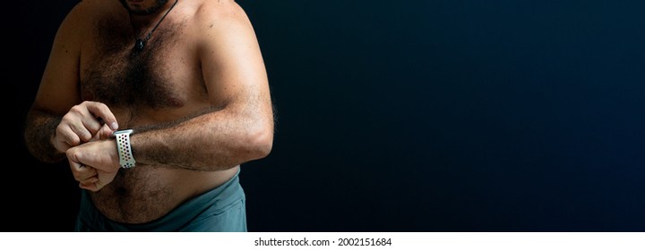 Person Standing Still While Watching The Calories Made On The Smartwatch. Copyspace Isolated Black