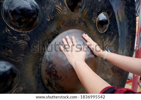 Similar – the hand of a woman touches the naked bottom of a statue