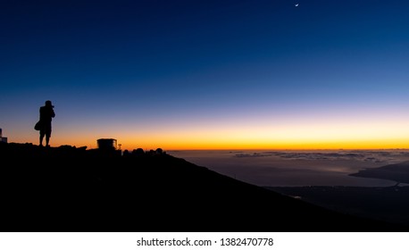 Person Taking A Picture Of The Haleakala Sunset