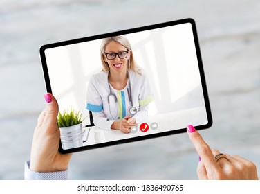 Person Talking With Doctor On Video Call On Tablet Computer