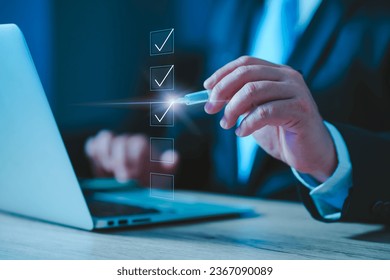 person ticking checkboxes with marker pen on checklist. Businessman use pen to tick correct sign mark in checkbox for quality document control checklist and business approve project concept. - Shutterstock ID 2367090089
