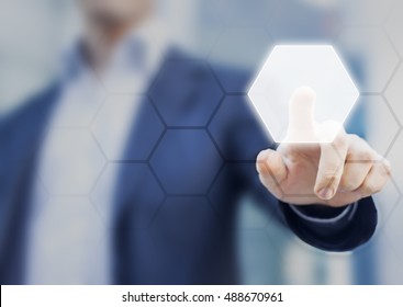 Person touching an hexagonal button on a digital interface. Concept about technology and choices