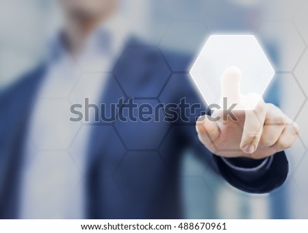 Person touching an hexagonal button on a digital interface. Concept about technology and choices